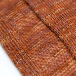 Dunkelorange-farbiges Textil mit Akzenten der Sumita Tunika aus 100% Babyalpaka