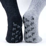 Alpaka ABS Socken in grau und schwarz mit Alpakas